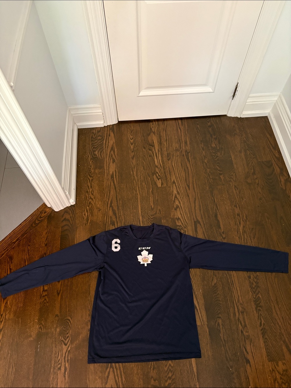 CCM Navy Long-Sleeve Kids Hockey Top with Maple Crest and Number 6